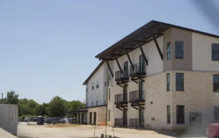 Exterior of two story apartment building.